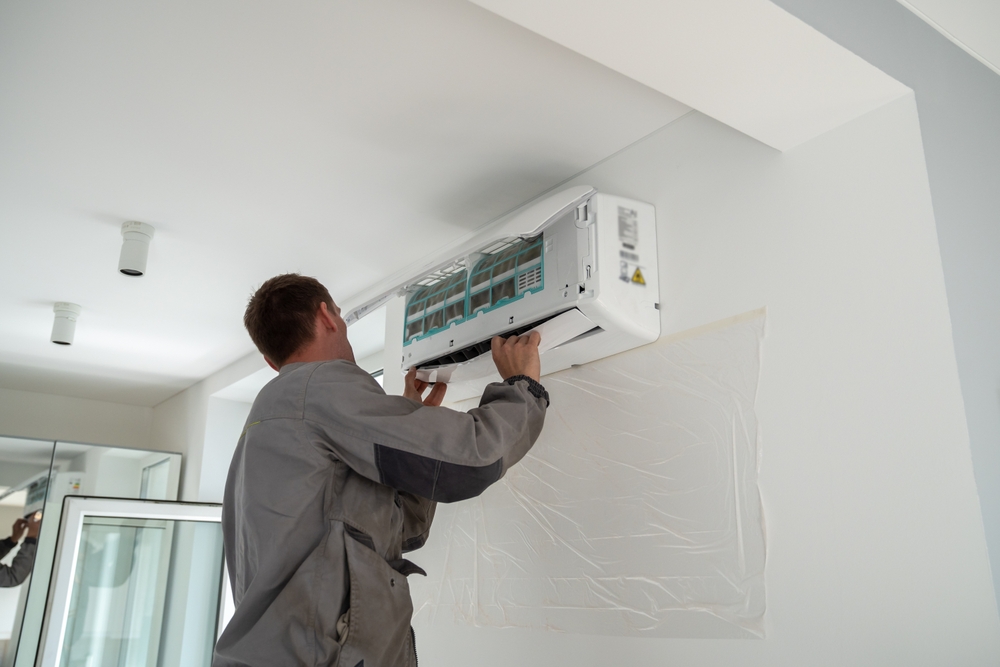 Male worker checking HVAC system